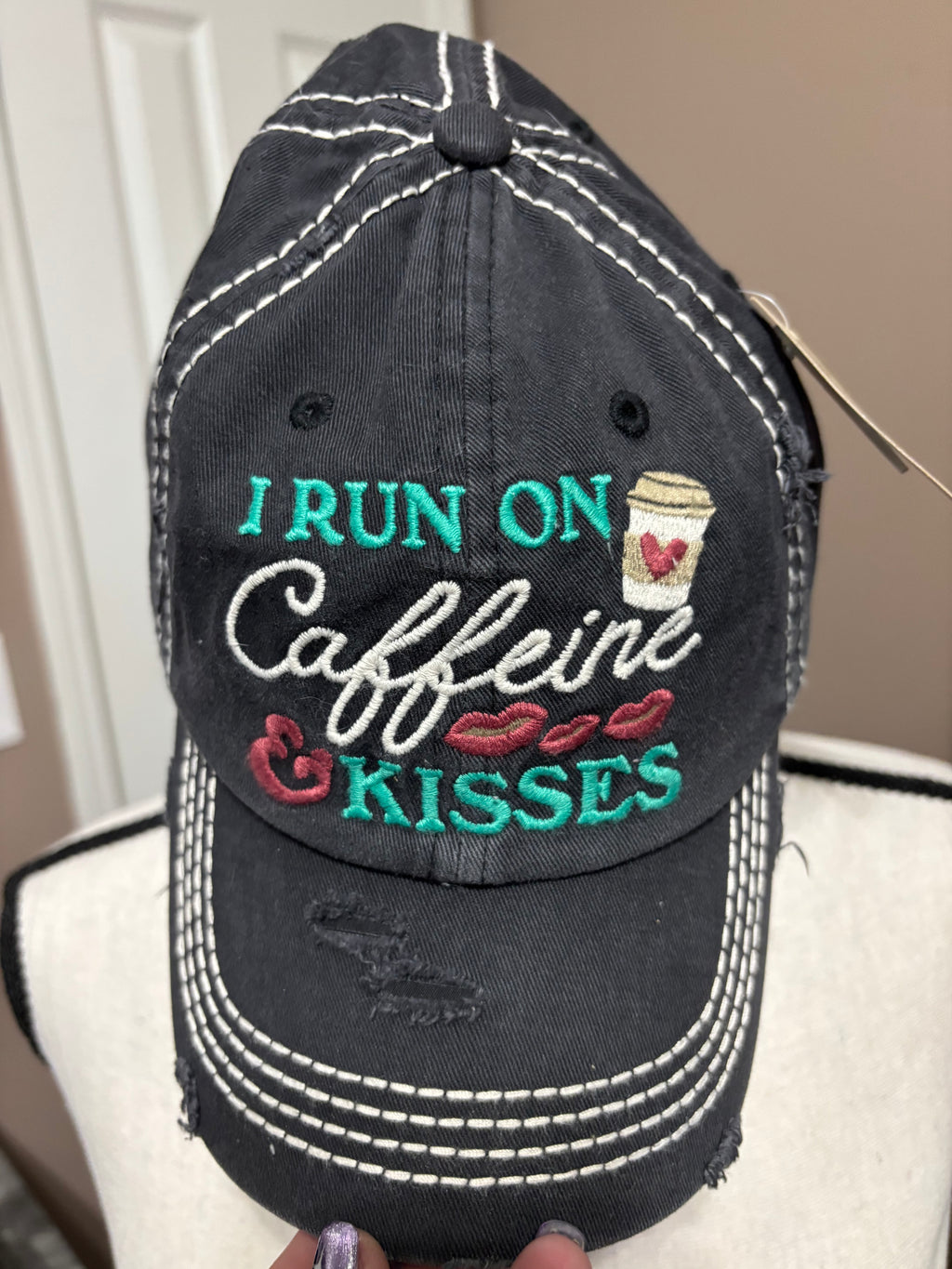 Black distressed I run on caffeine and kisses ballcap